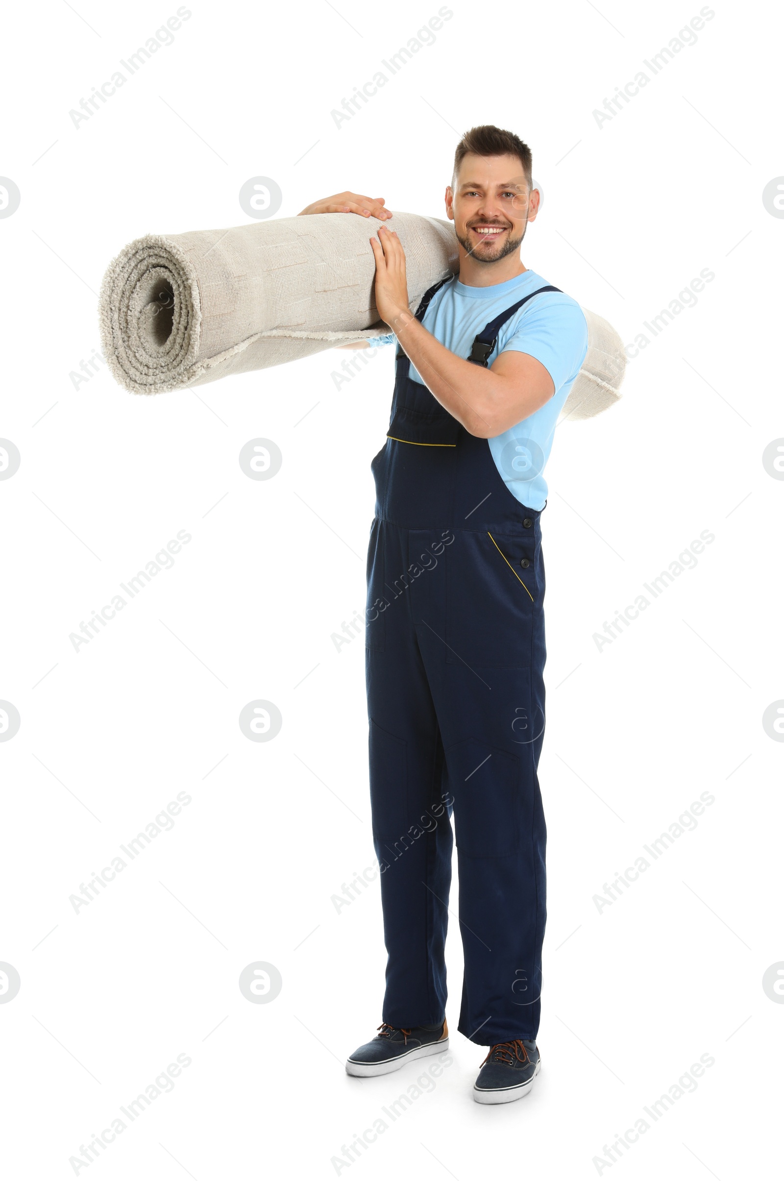 Photo of Portrait of moving service employee with carpet on white background