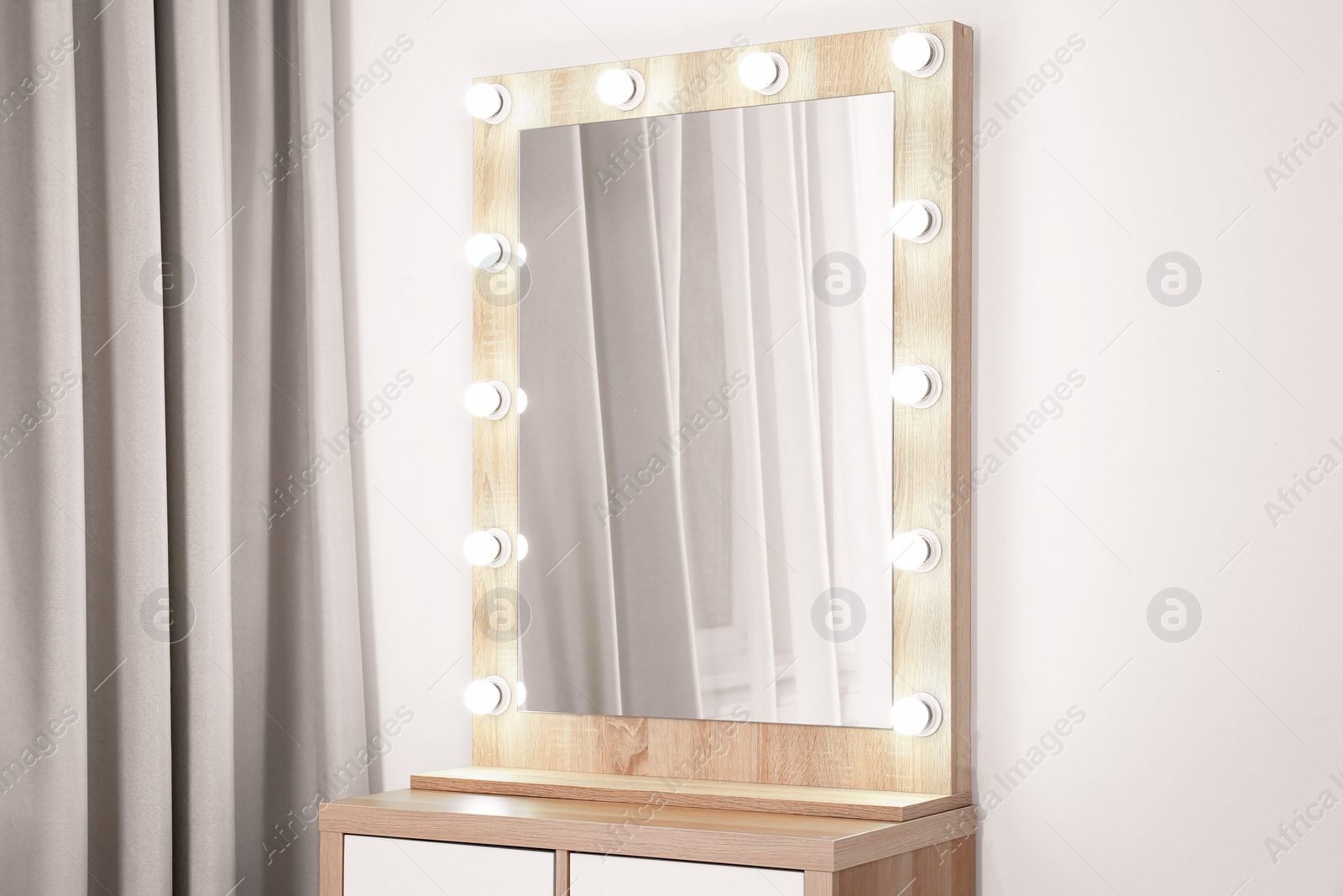 Photo of Dressing room interior with makeup mirror and table