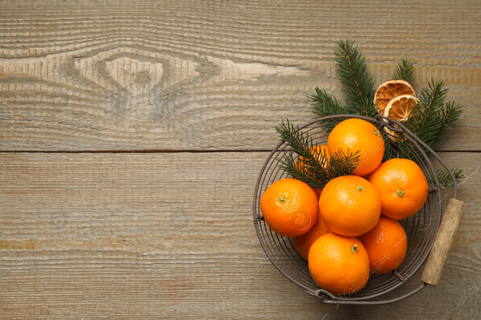 Photo of Flat lay Christmas composition with fresh tangerines on wooden table, space for text