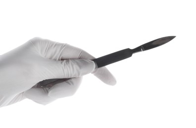 Photo of Doctor holding surgical scalpel on white background, closeup. Medical instrument