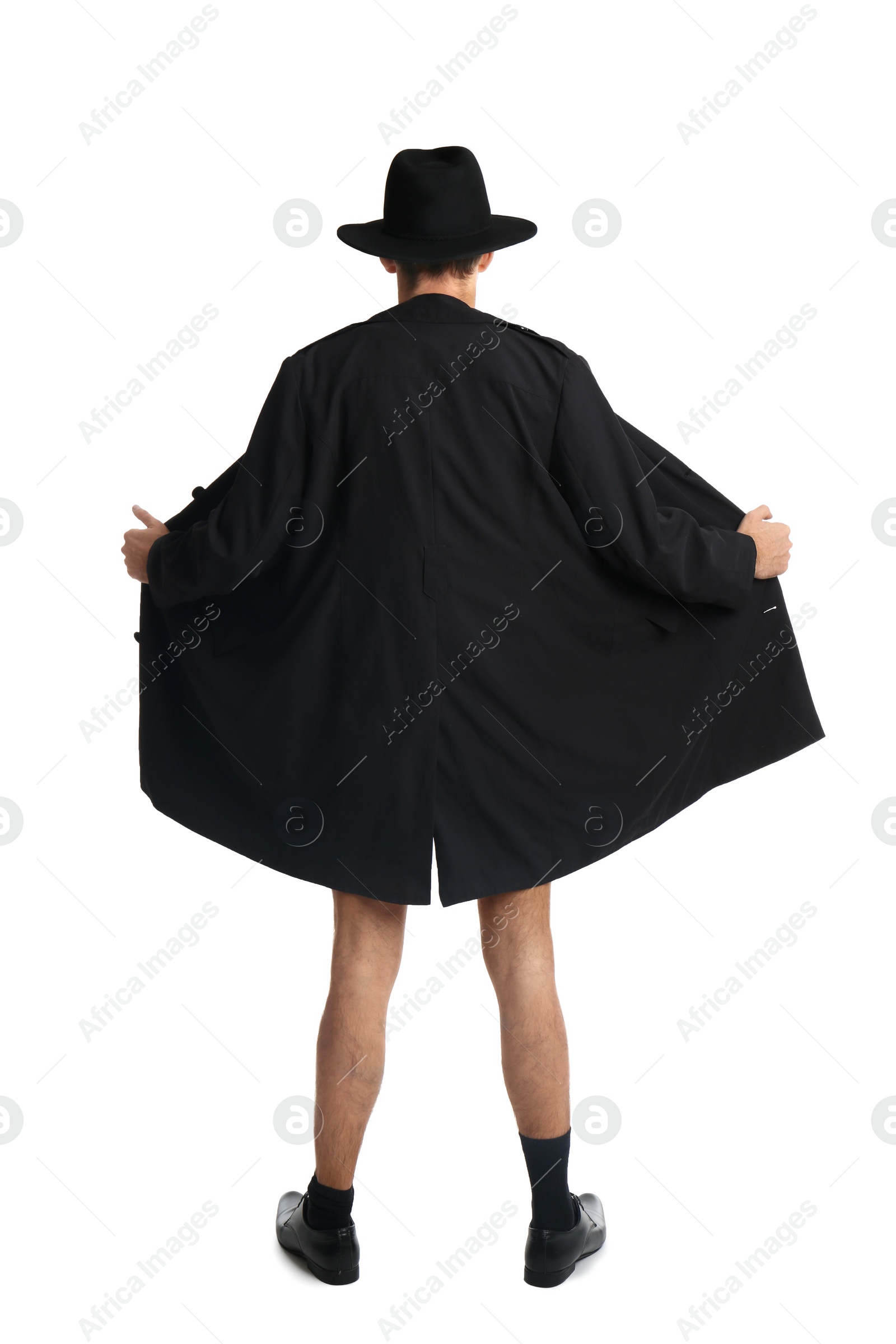 Photo of Exhibitionist exposing naked body under coat isolated on white, back view