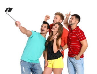 Happy young people taking selfie on white background