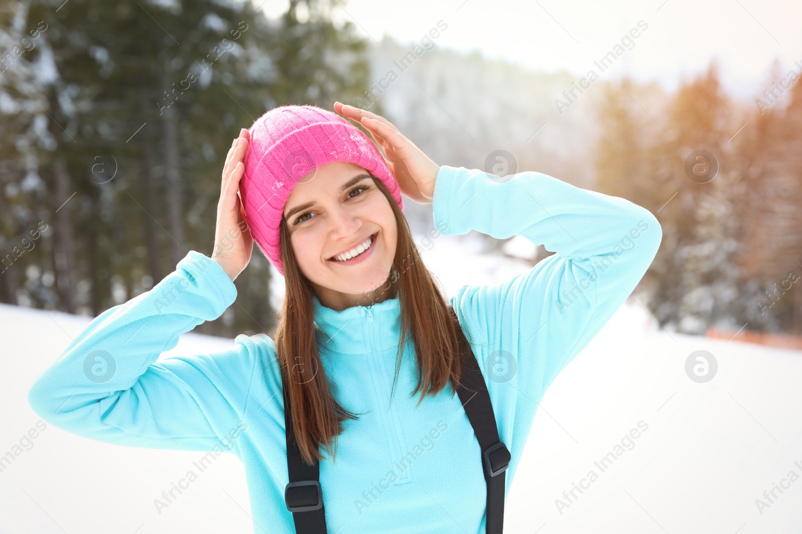 Photo of Young woman at mountain resort. Winter vacation