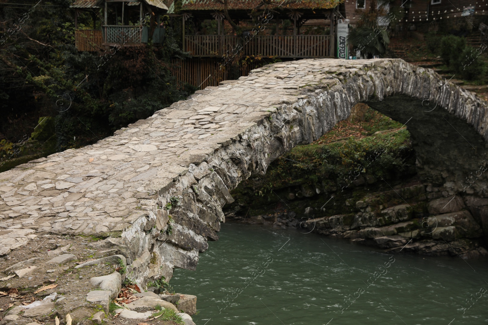 Photo of Adjara, Georgia - November 19, 2022: Picturesque view of stone arched bridge over Acharistskali river