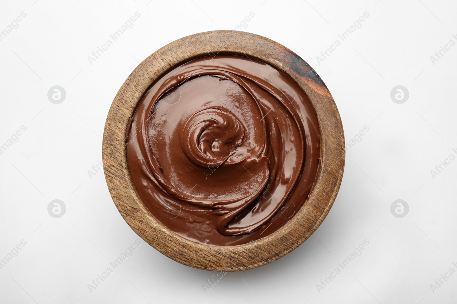 Photo of Bowl of tasty chocolate spread isolated on white, top view