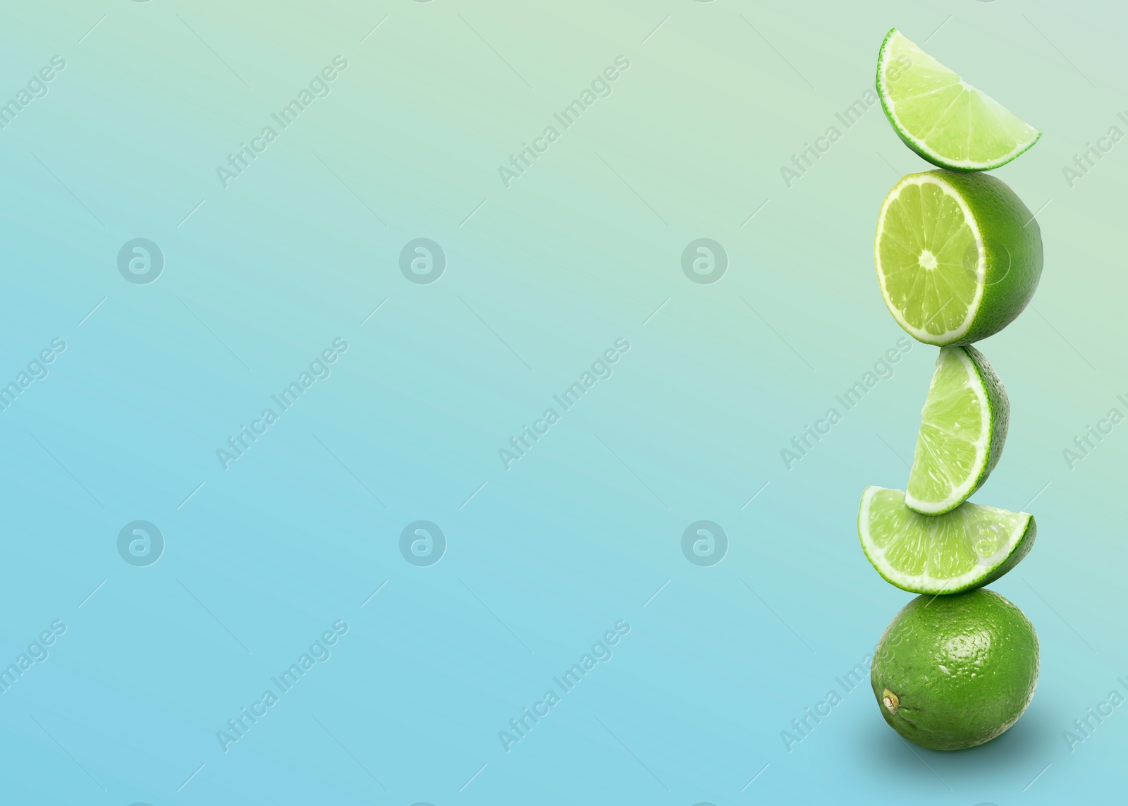 Image of Stacked whole and cut limes on color background, space for text