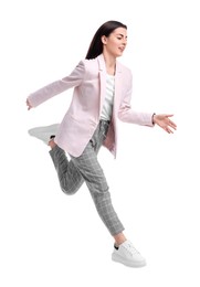 Beautiful young businesswoman running on white background