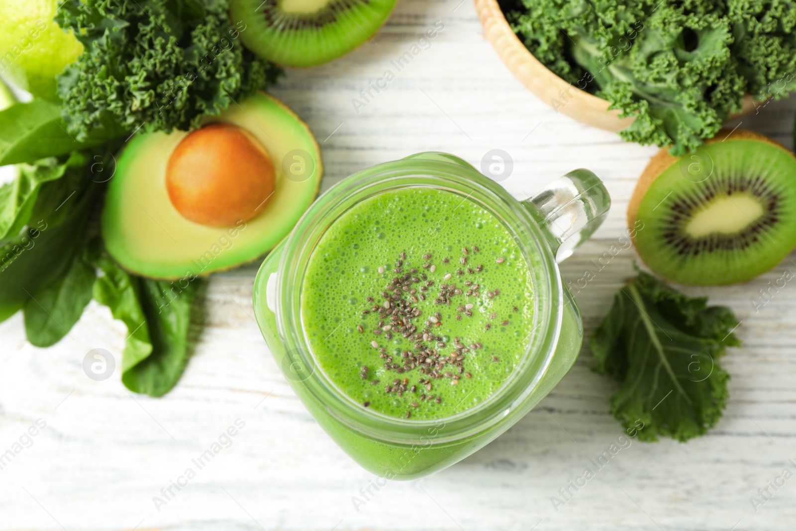 Photo of Flat lay composition with kale smoothie on white wooden table