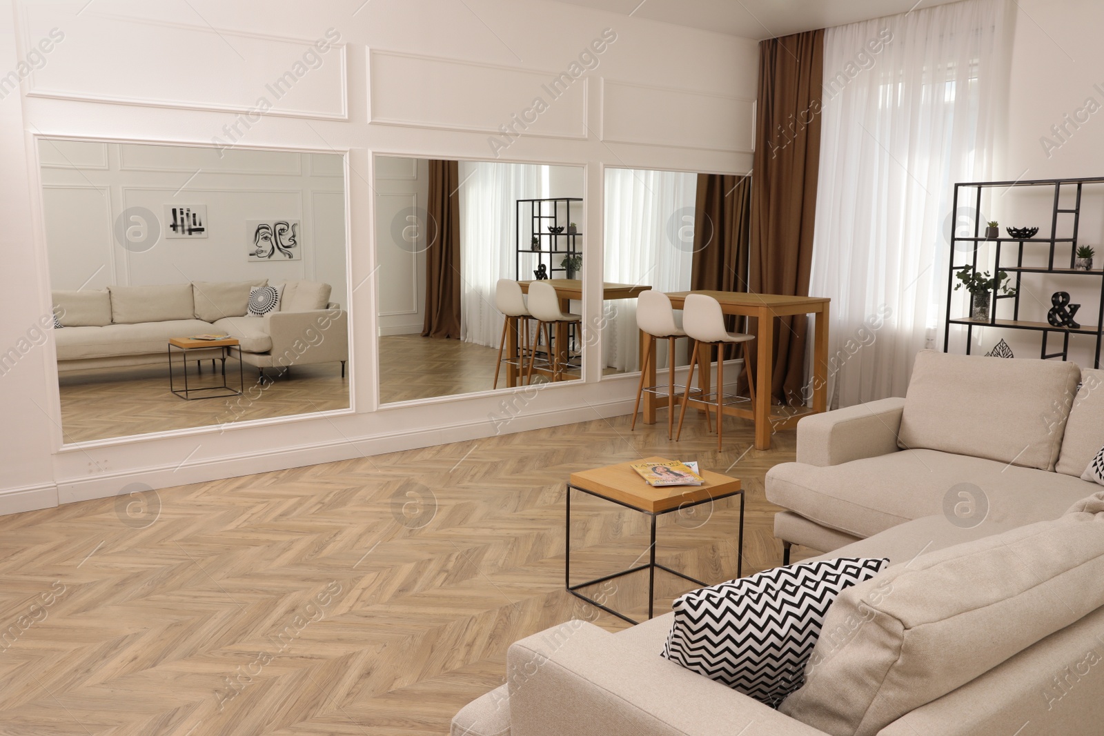 Photo of Modern living room with parquet flooring and stylish furniture