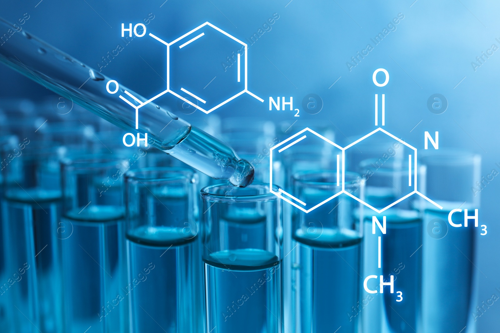 Image of Dripping reagent into test tube with liquid on blue background, closeup