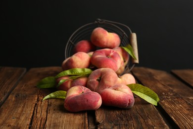 Fresh ripe donut peaches on wooden table