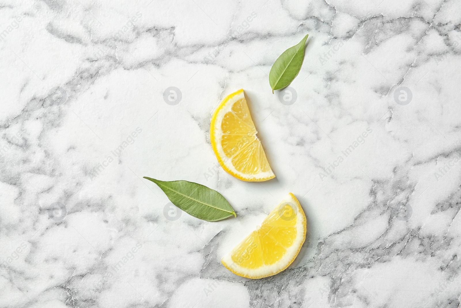 Photo of Flat lay composition with sliced lemon on marble background