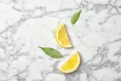 Photo of Flat lay composition with sliced lemon on marble background