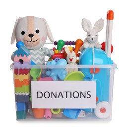 Photo of Donation box full of different toys isolated on white