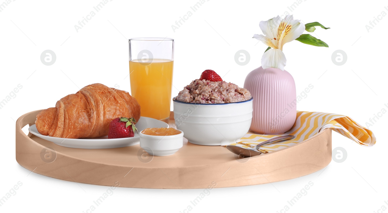 Photo of Wooden tray with delicious breakfast and beautiful flower on white background