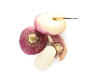 Photo of Cut and whole fresh ripe turnips on white background, top view