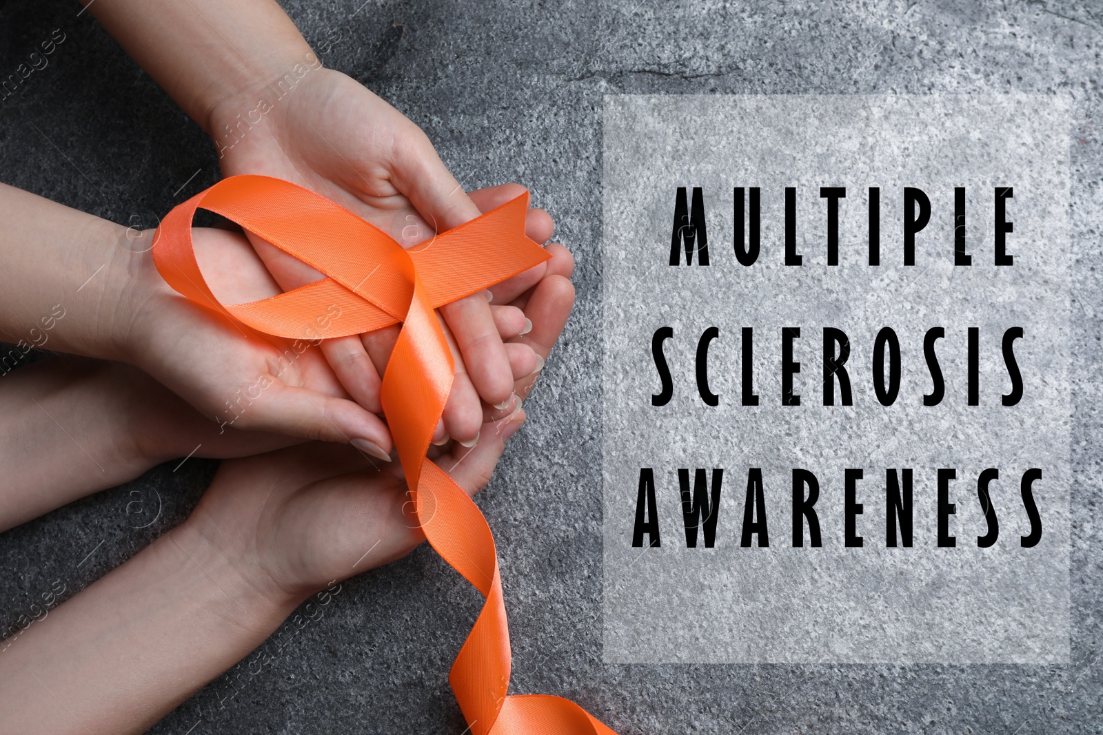 Image of Multiple Sclerosis Awareness Day. People with orange ribbon on grey background, top view