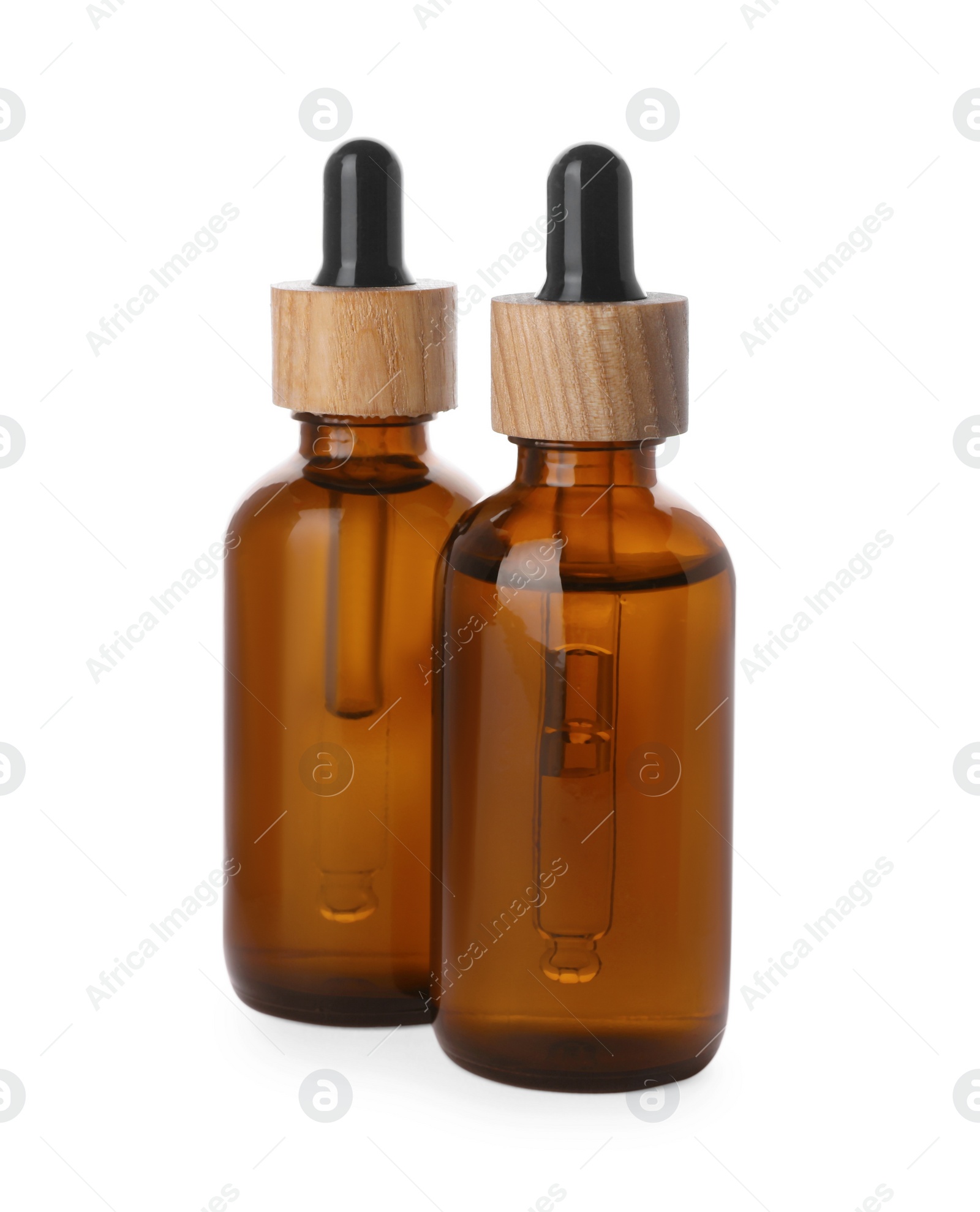 Photo of Bottles of essential oil on white background