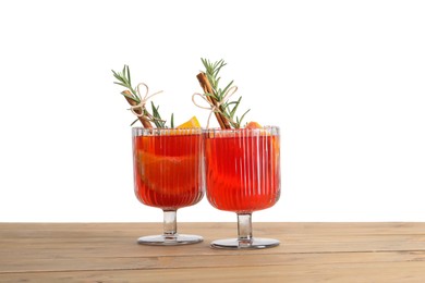 Christmas Sangria cocktail in glasses on wooden table against white background
