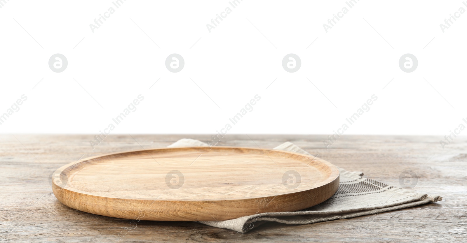 Photo of Empty plate and napkin on wooden table against white background