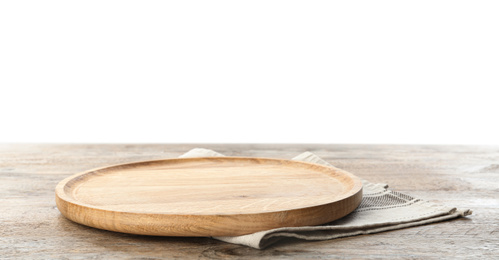 Photo of Empty plate and napkin on wooden table against white background