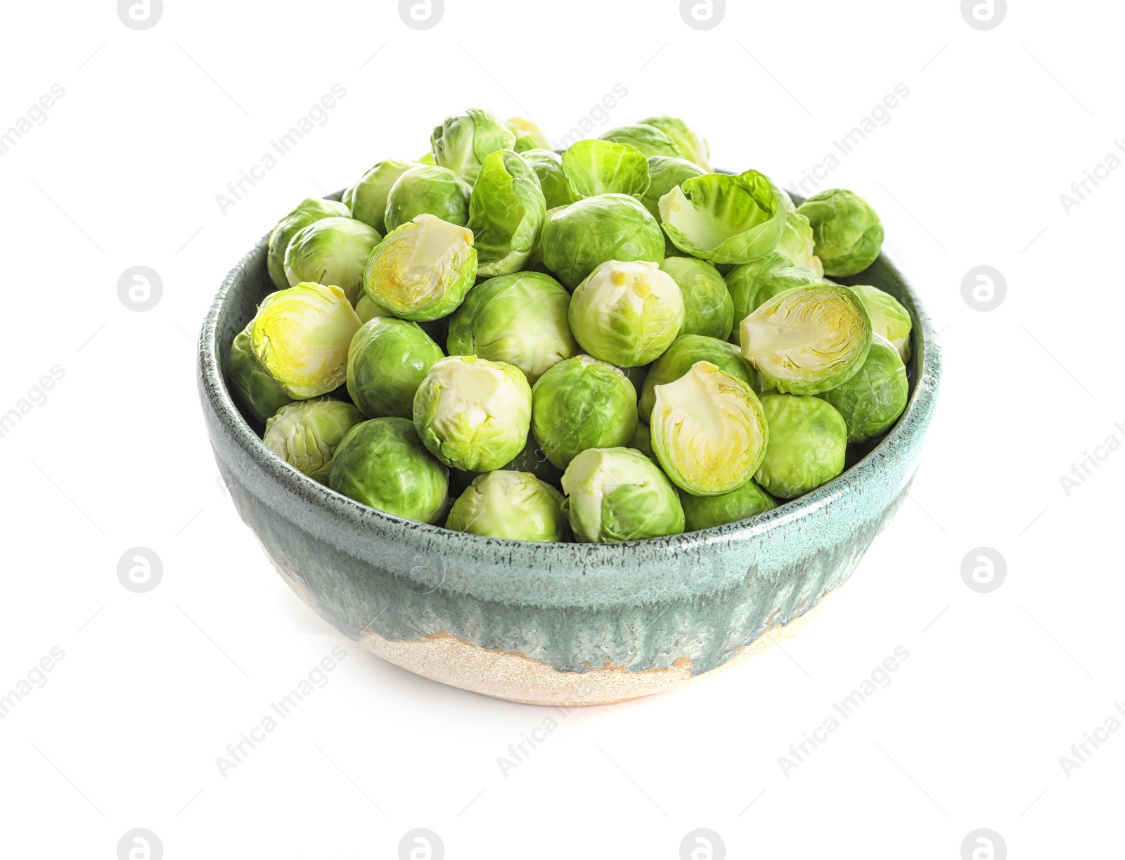 Photo of Bowl of fresh Brussels sprouts isolated on white