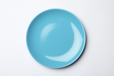 Clean empty plate on white background, top view