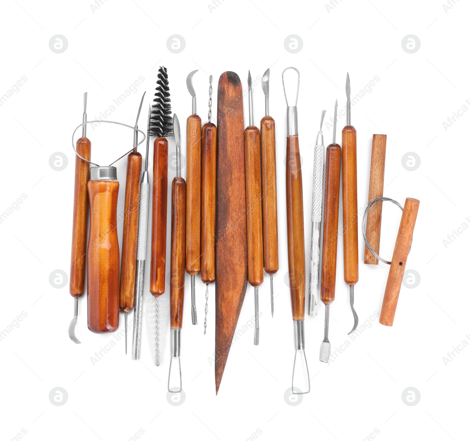 Photo of Set of different clay crafting tools isolated on white, top view