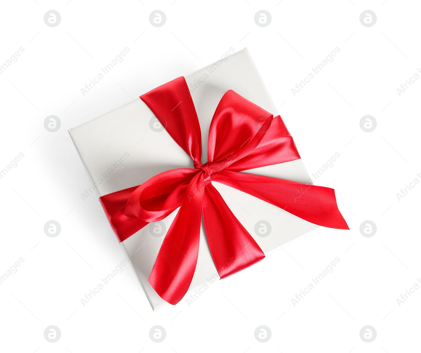 Photo of Gift box with ribbon on white background, top view