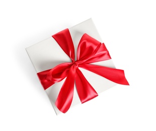 Gift box with ribbon on white background, top view