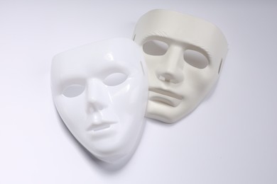 Theater arts. Two masks on white background, top view