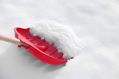 Photo of Shoveling snow outdoors, closeup. Space for text