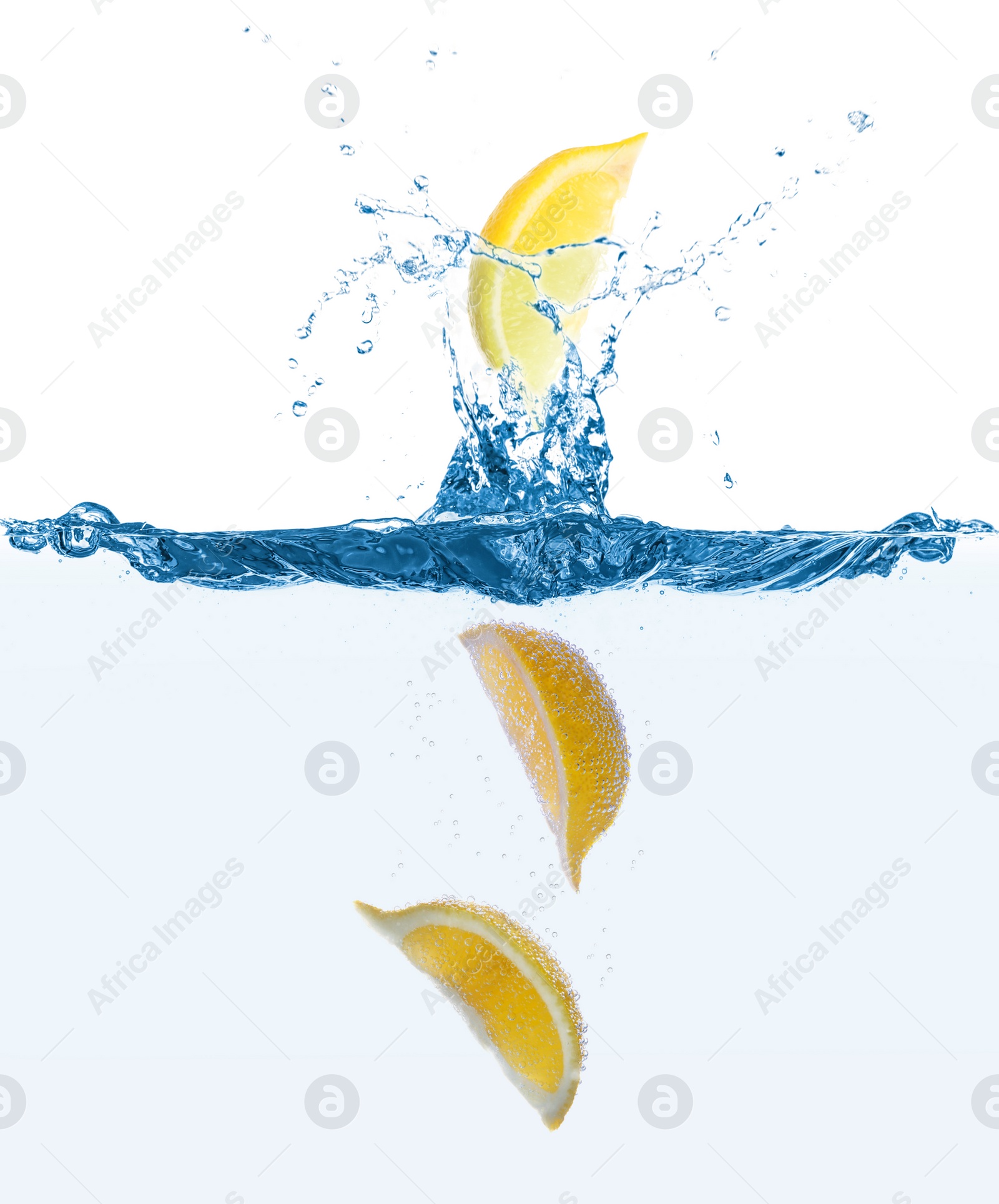 Image of Fresh ripe lemon falling into water with splashes on white background