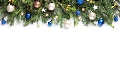 Photo of Fir branches with Christmas decorations on white background, flat lay