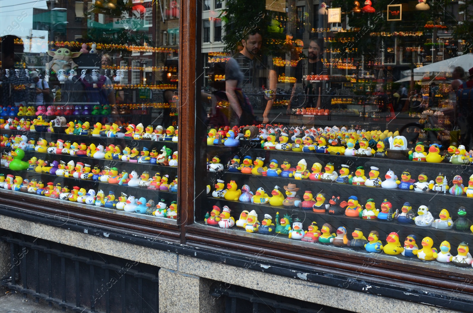 Photo of Amsterdam, Netherlands - June 18, 2022: Many toys on shelves in Duck Store