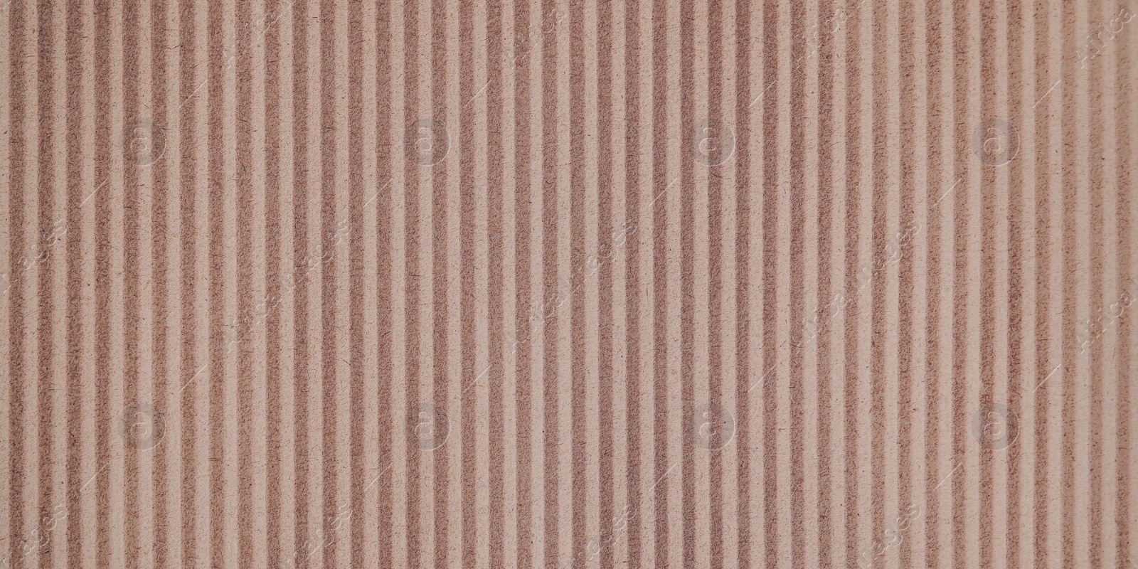 Image of Wall paper design. Brown corrugated sheet of cardboard as background