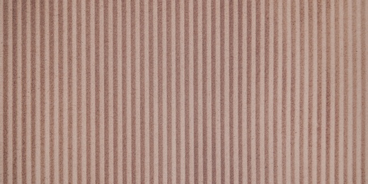 Wall paper design. Brown corrugated sheet of cardboard as background