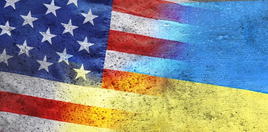 Image of National flags of Ukraine and USA symbolizing partnership between countries. Banner design