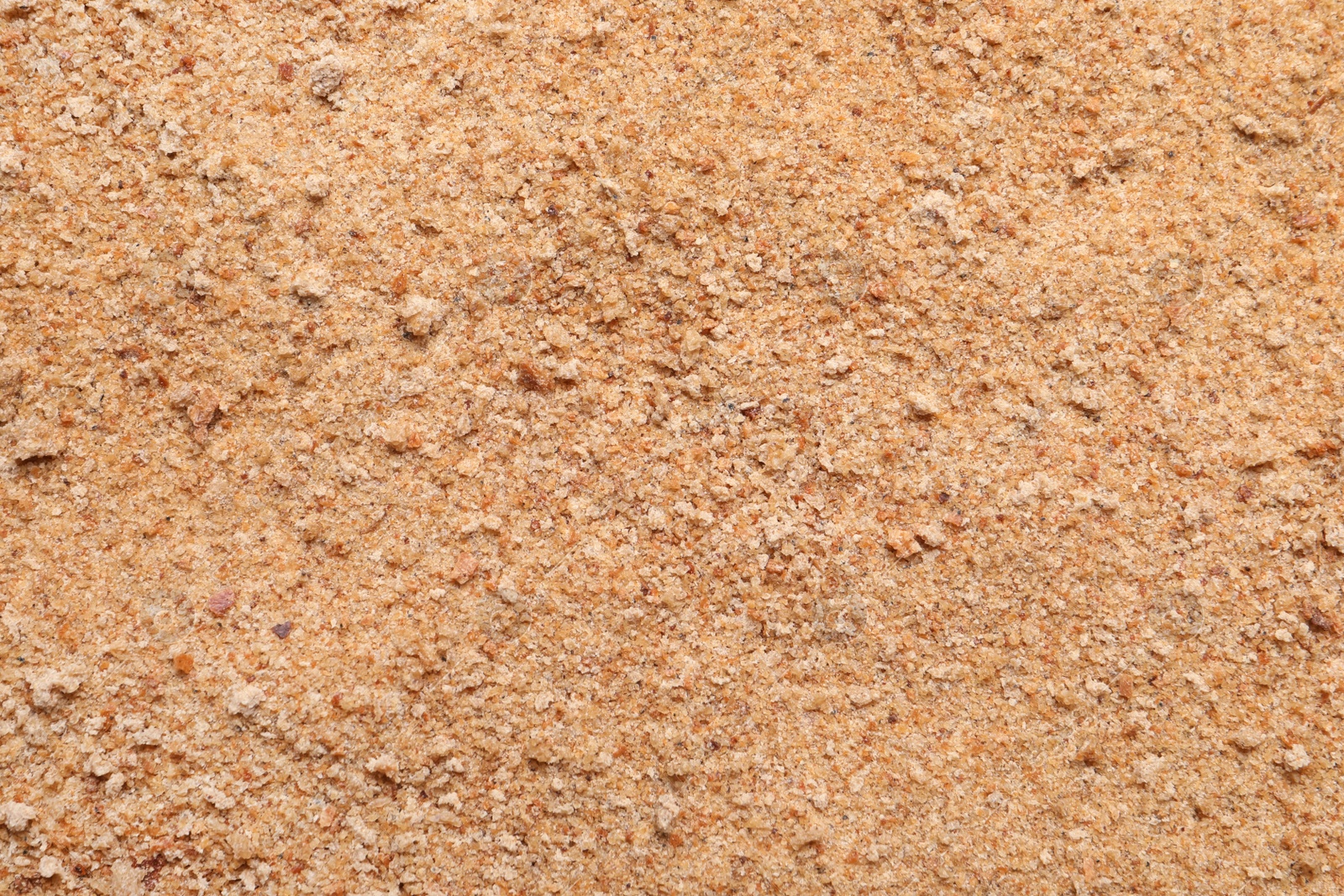 Photo of Pile of fresh bread crumbs as background, top view