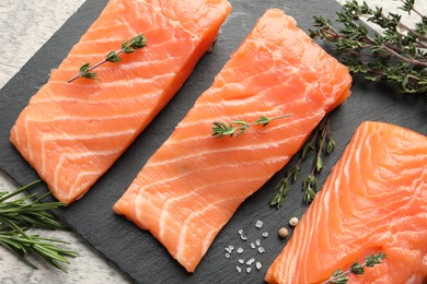 Photo of Fresh raw salmon and ingredients for marinade on light grey table, flat lay