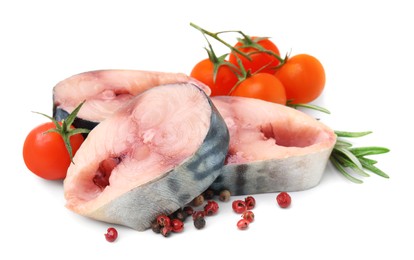 Photo of Pieces of mackerel fish with cherry tomatoes, rosemary and spices on white background