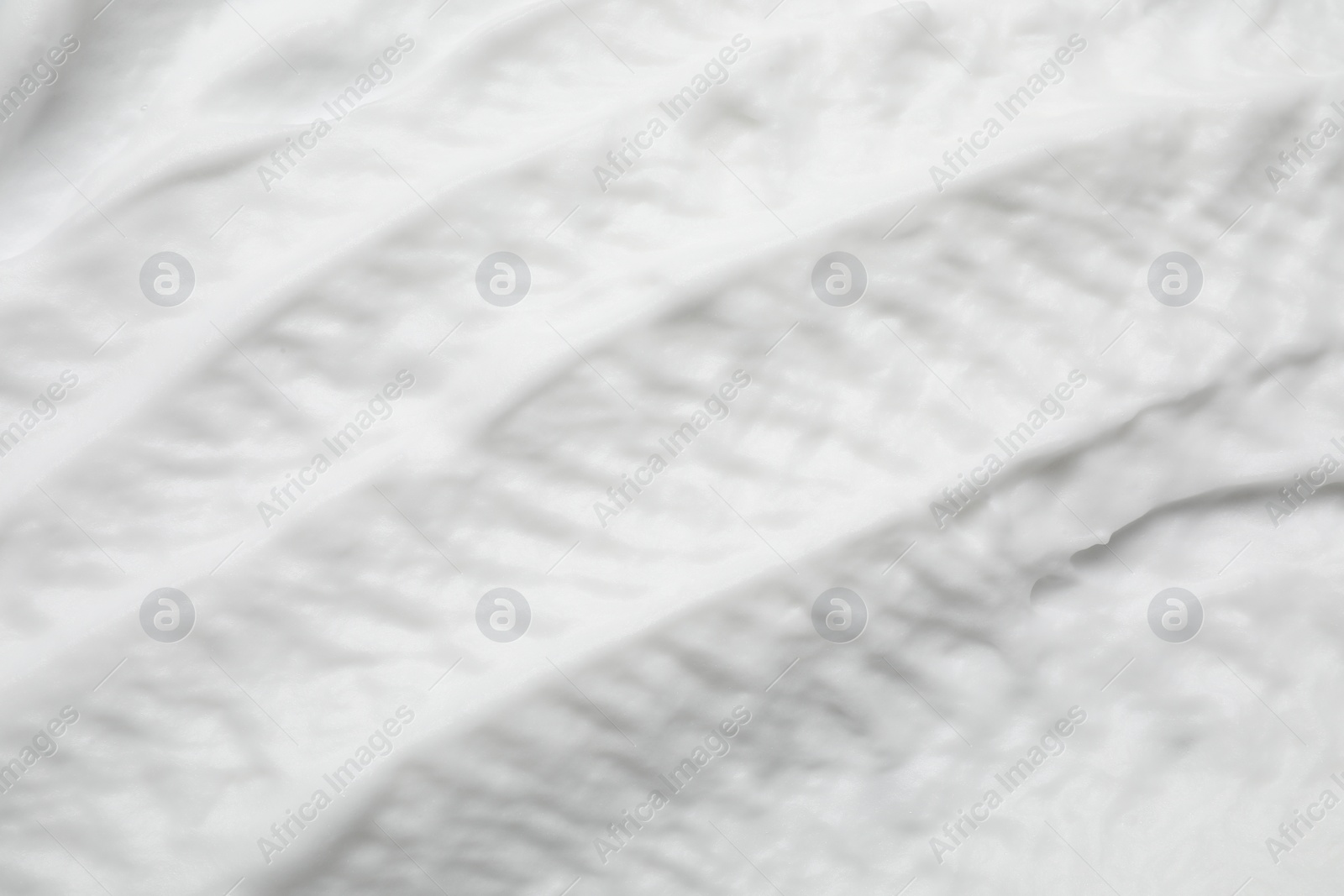 Photo of Texture of white shaving foam as background, top view