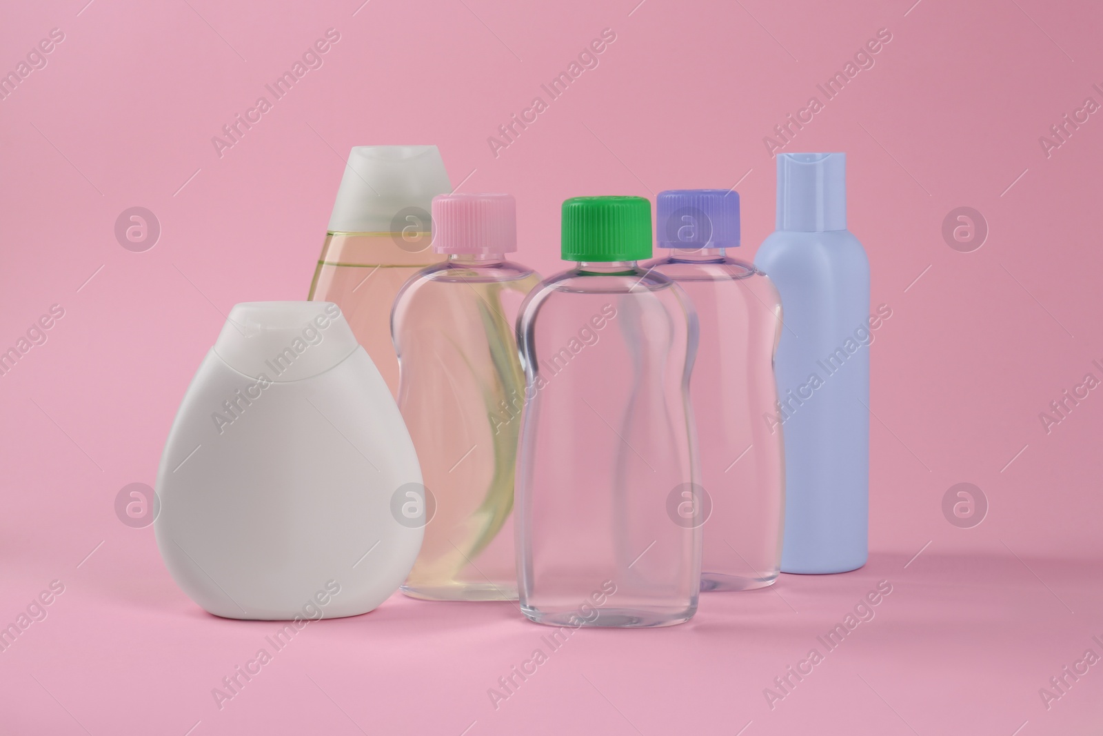 Photo of Different skin care products for baby on pink background. Space for text