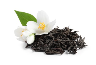 Photo of Dry tea leaves and fresh jasmine flowers on white background