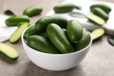 Photo of Fresh seedless avocados on grey table, closeup