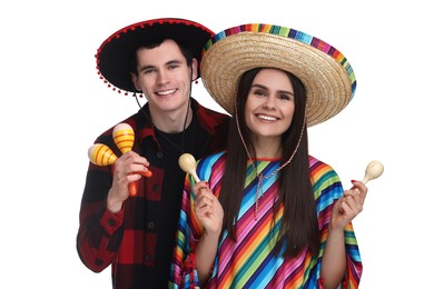 Lovely couple in Mexican sombrero hats with maracas on white background