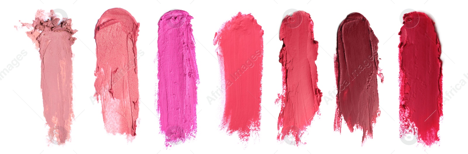 Image of Smears of different beautiful lipsticks on white background, top view. Banner design