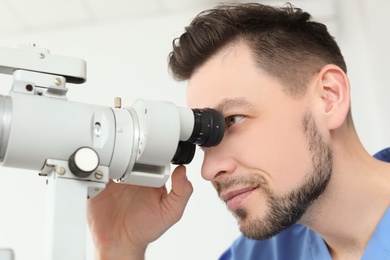 Ophthalmologist examining patient in clinic