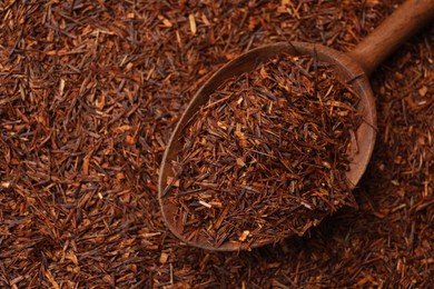 Photo of Rooibos tea and wooden spoon, top view