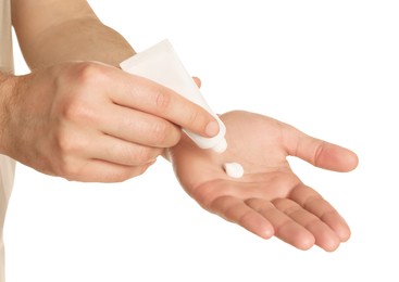 Photo of Man applying cream onto hand against white background, closeup